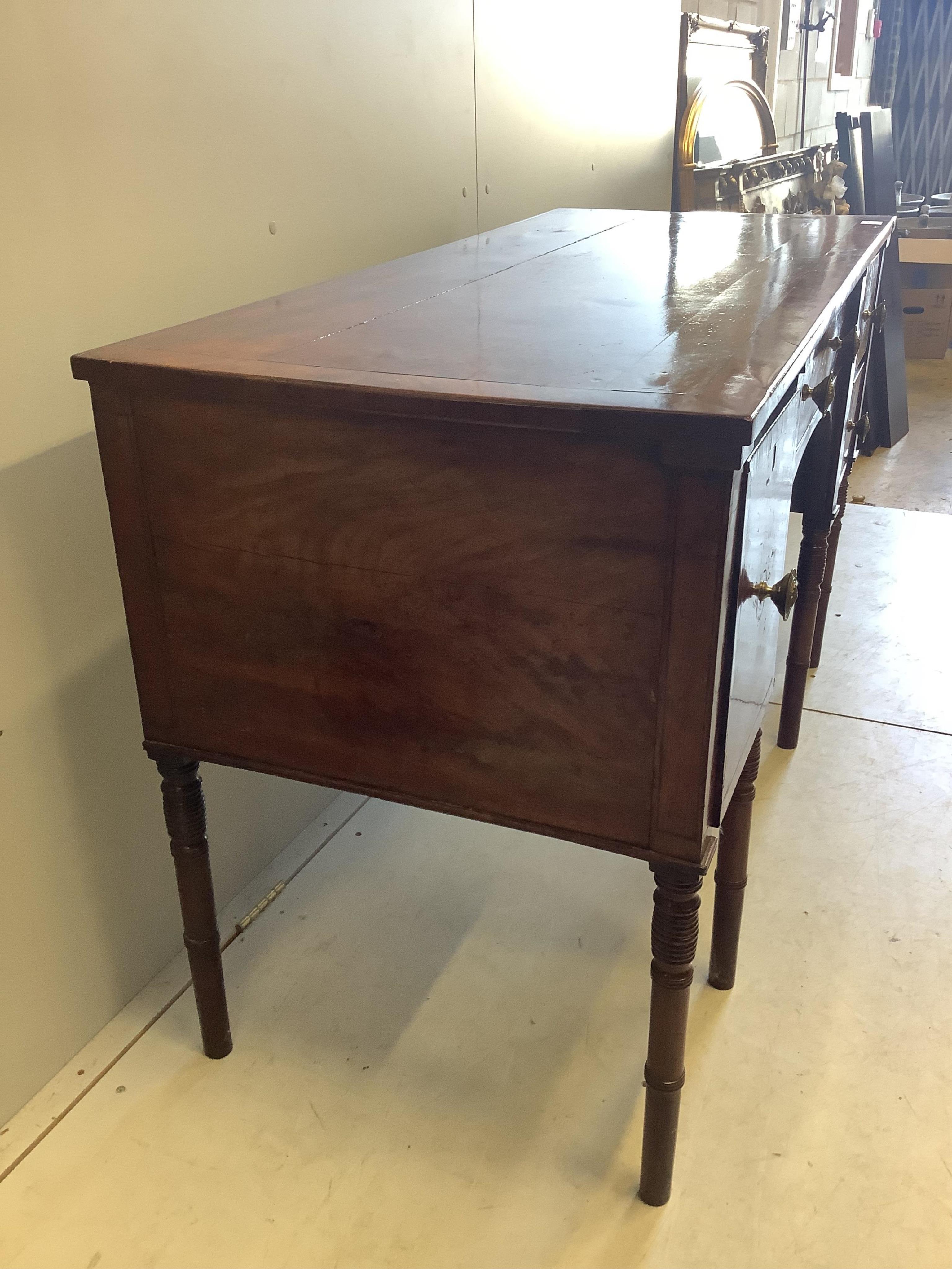 A Regency mahogany sideboard, width 137cm, depth 60cm, height 84cm. Condition - poor